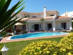 View of pool and villa from garden